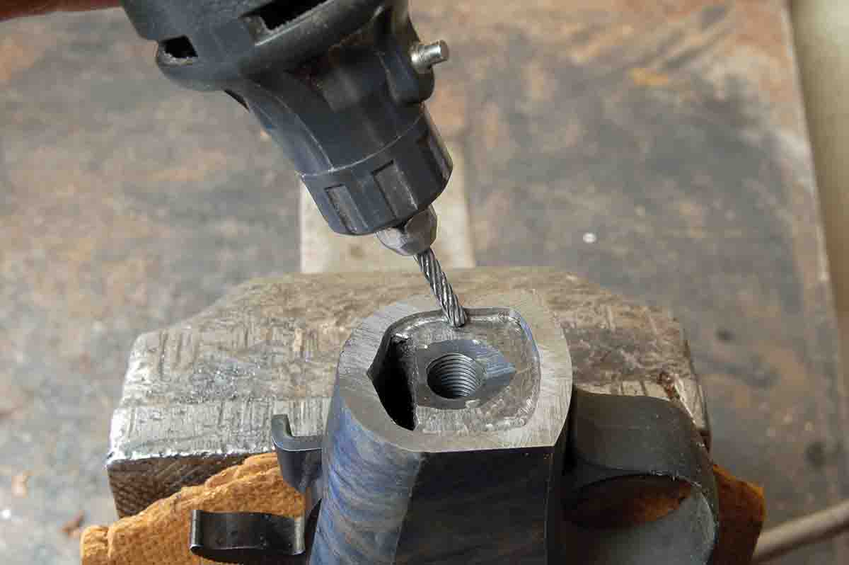 Cut the mortise in the receiver with a Dremel tool using a carbide cutter.